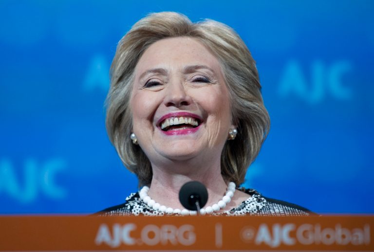 Hillary Clinton smiles as he addresses the American Jewish Committee Global Forum closing plenary in Washington on May 14. (AP/Cliff Owen)