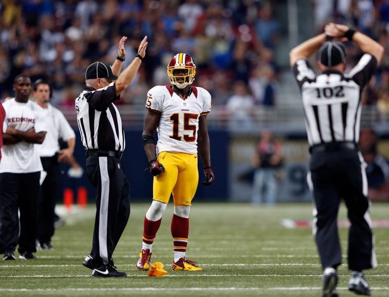 ST LOUIS, MO - SEPTEMBER 16:  Wide receiver Josh Morgan #15 of the Washington Redskins is penalized after committing a personal foul in the last minute of the game resulting in a fourth and long scenario against the St. Louis Rams at Edward Jones Dome on September 16, 2012 in St Louis, Missouri.  (Photo by Jamie Squire/Getty Images)
