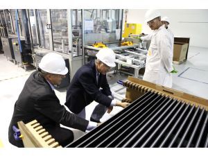 Interior Secretary Ken Salazar, center, inspects Abound Solar's Colorado manufacturing facility as Julian Hawkins, a company representative, looks on. (AP Photo)
