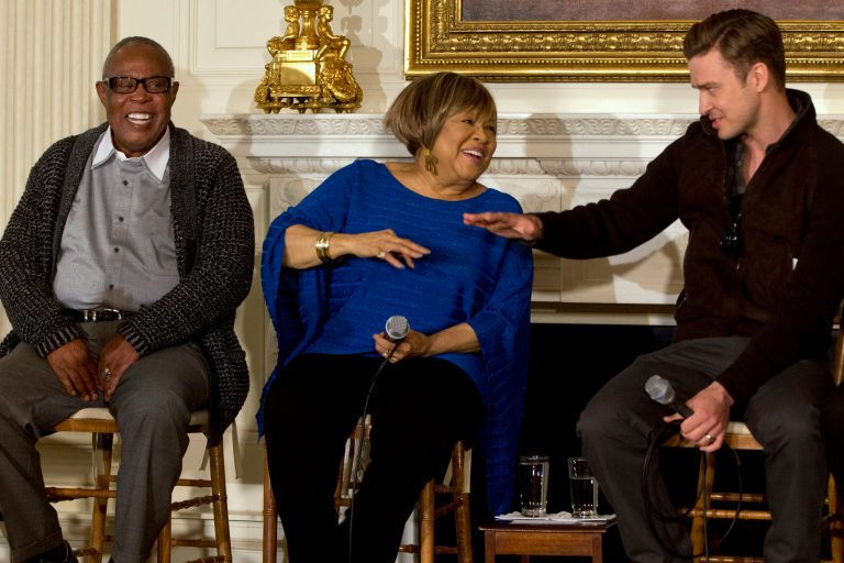 Singers, from left, Sam Moore, Mavis Staples, and Justin Timberlake, joke together during a workshop, 