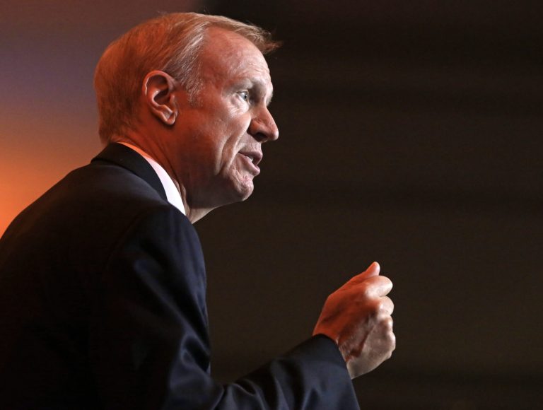 FILE - In this Aug. 28, 2014 file photo, Illinois Republican gubernatorial candidate Bruce Rauner answers questions during the Metropolitan Planning Council's Annual Luncheon. Rauner and his opponent Governor Pat Quinn, took personal and nasty jabs at each other during a televised side-by-side newspaper editorial board meeting Tuesday, Sept. 9, 2014 in Chicago. The tone during the nearly 90-minute debate-style meeting before the Chicago Tribune's editorial board was a clear sign the gloves are off in one of the most competitive governor's races nationwide.(AP Photo/M. Spencer Green.File)