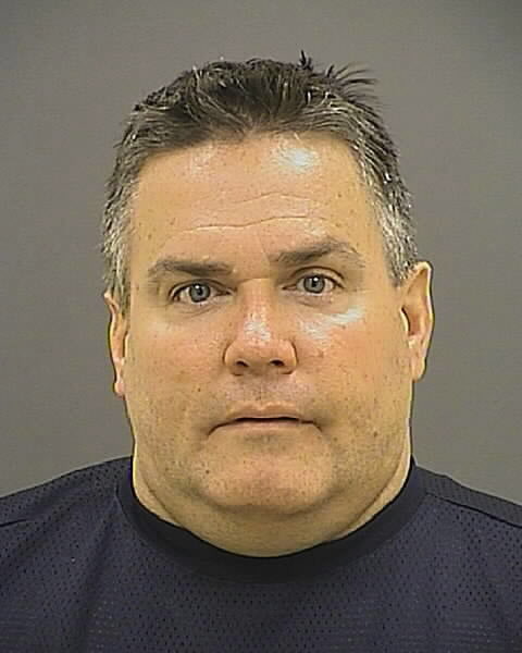 FILE - This file booking photo provided by the Baltimore Police Department shows Jeffrey Bolger, 49, of Eldersburg, Md. Attorneys representing Bolger, a Baltimore Police officer charged with animal cruelty in the death of a dog in June, have asked a judge to dismiss the charges. (AP Photo/Baltimore Police Department, File)