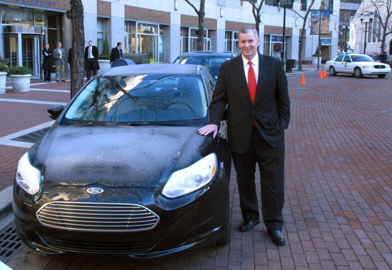   Indianapolis Mayor Greg Ballard talks poses with electric and plug-in hybrid vehicles like these shown following an announcement that the city will replace it's fleet of cars with similar type vehicles in Indianapolis, Wednesday, Dec. 12, 2012. Indianapolis plans to replace its entire fleet with electric and plug-in hybrid vehicles by 2025. (AP Photo/Rick Callahan)  