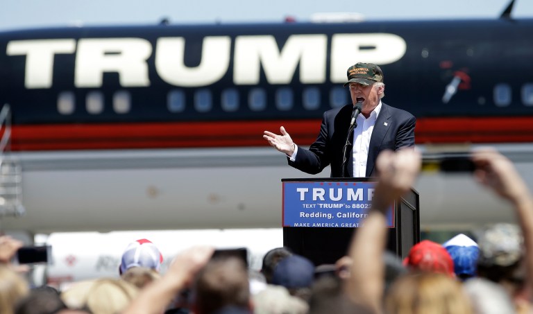 Donald Trump appeared to put his foot in his mouth Friday when he interrupted a story to point out a black man at a California rally at Redding Municipal Airport. (AP Photo/Rich Pedroncelli