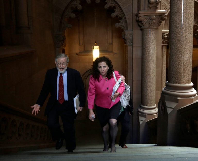 FILE--In this June 19, 2014 file photo, Assemblyman Richard Gottfried, D-Manhattan, left, and Sen. Diane Savino, D-Staten Island, walk up a staircase after meeting with Gov. Andrew Cuomo at the Capitol in Albany, N.Y. (AP Photo/Mike Groll, File)