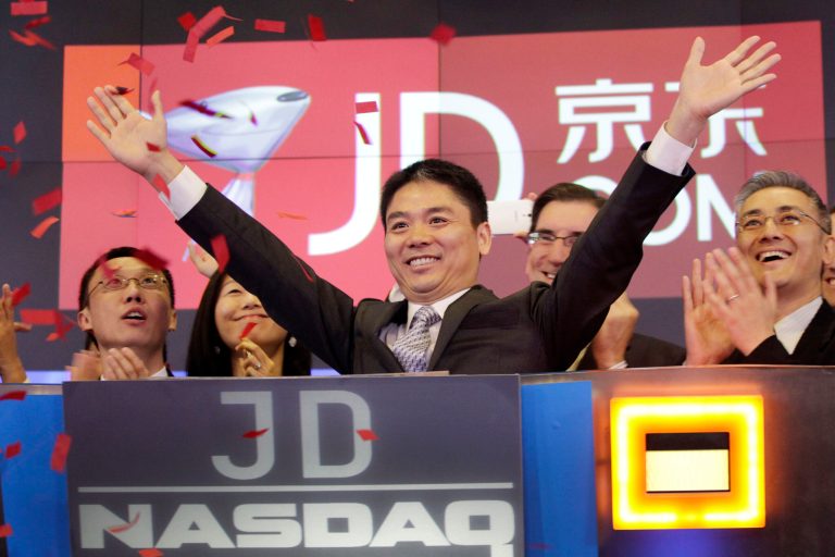 Qiangdong Liu, CEO of JD.com, raises his arms to celebrate the IPO for his company at the Nasdaq MarketSite, Thursday, May 22, 2014 in New York. JD.com, China's No. 2 e-commerce service, is headquartered in Beijing. (AP Photo/Mark Lennihan)