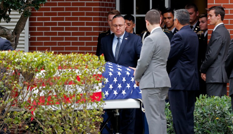 The casket of Alaina Petty, a victim of Wednesday's mass shooting at Marjory Stoneman Douglas High School, leaves her funeral in Coral Springs, Fla. The family of Petty was presented the JROTC Medal of Heroism during a memorial service Monday. (AP Photo/Gerald Herbert)