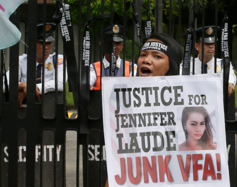 A protester shouts slogans during a rally at the Department of Foreign Affairs to demand justice in the killing of Filipino transgender Jeffrey 