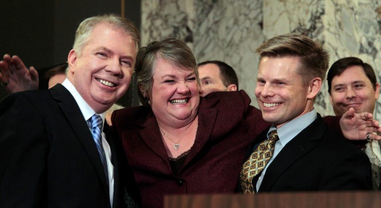   FILE - In this Feb. 13, 2012 file photo, Rep. Maureen Walsh, R-Walla Walla, center, playfully throws her arms around Sen. Ed Murray, D-Seattle, left, and Rep. Jamie Pedersen, D-Seattle, moments before Gov. Chris Gregoire signed into law a measure that legalizes same-sex marriage, in Olympia, Wash. Opponents of gay marriage have an unblemished track record in U.S. elections, chalking up 32 victories in 32 public votes. Encouraged by the prospects in Washington and Maine, gay marriage supporters are optimistic that they can end their losing ways this year, with four states voting on the issue in November. (AP Photo/Elaine Thompson, File)  