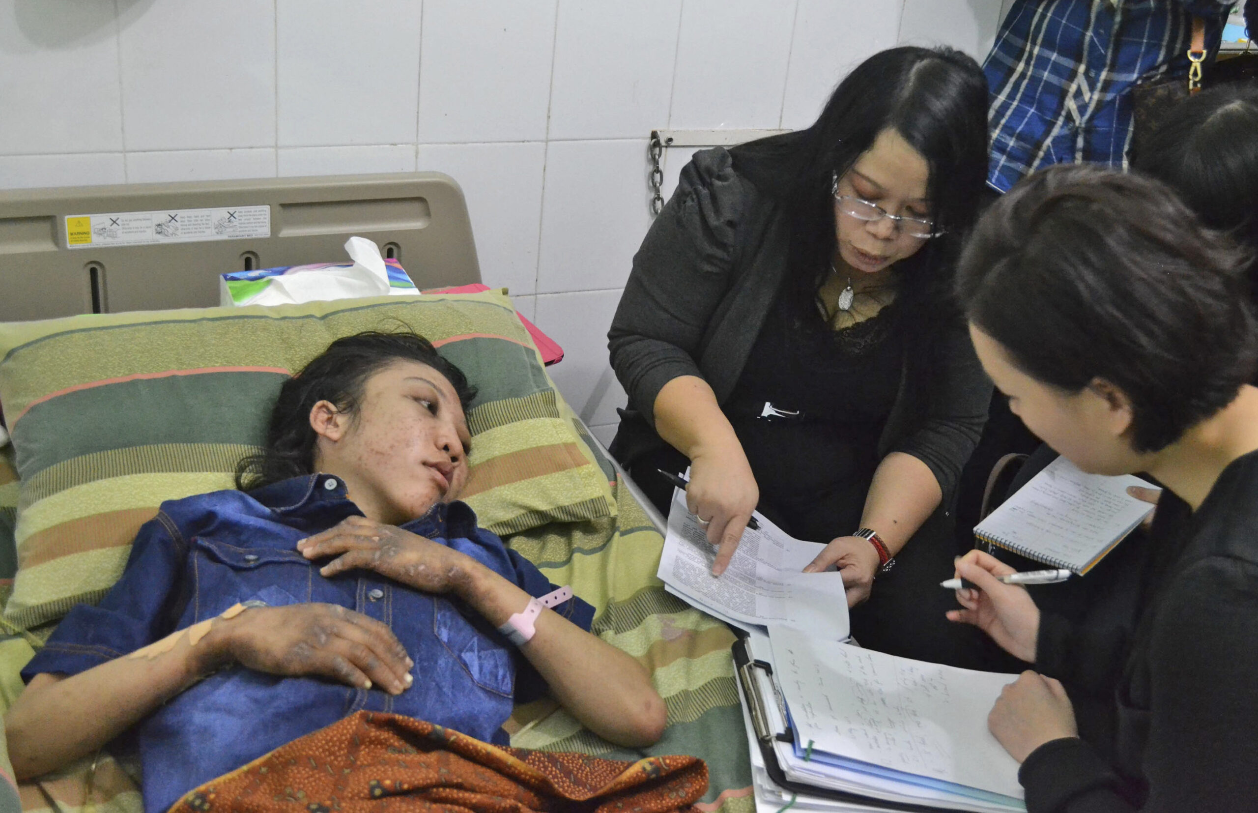 Hong Kong police question maid abuse victim