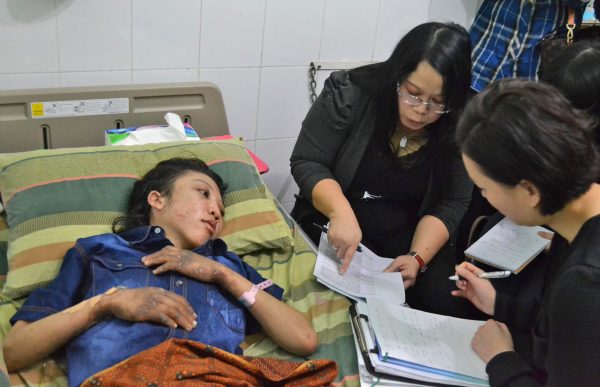 Hong Kong police question maid abuse victim