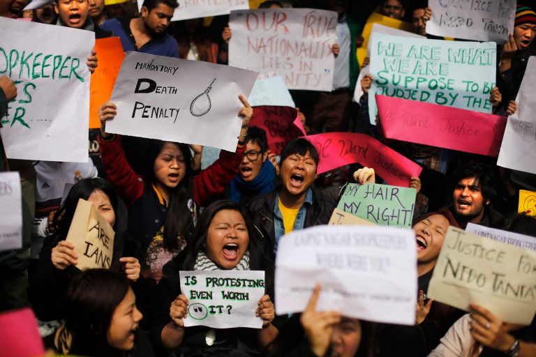 Protesters mostly students from northeastern states of India shout slogans during a protest in New Delhi, India, Saturday, Feb. 1, 2014. The beating and subsequent death in New Delhi of a university student, 20-year-old Nido Tania, from India's remote northeast has sparked a furious outcry against racism and criticism of police in the Indian capital. (AP Photo/Altaf Qadri)
