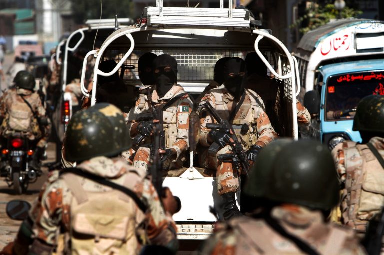   Pakistan paramilitary troops patrol in Karachi, Pakistan, Monday, Dec. 10, 2012. Gunmen attacked a checkpoint manned by paramilitary forces on the outskirts of the southern city of Karachi, killing soldiers, police said. (AP Photo/Shakil Adil)  