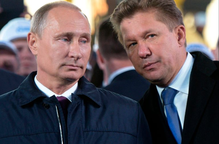 Russian President Vladimir Putin, left, listens to Alexei Miller, CEO of Russian natural gas giant Gazprom during the ceremony marking the construction of gas pipeline 