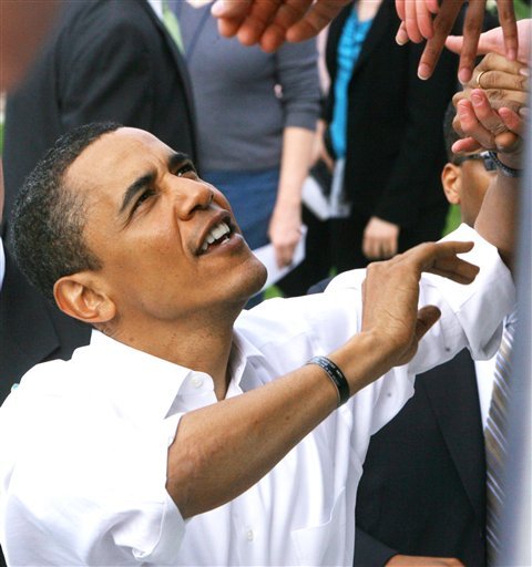 ADVANCE FOR SATURDAY, NOV. 3 AND THEREAFTER - In an April 11, 2008 photo,  Presidential candidate Barack Obama greets supporters at Bill Armstrong Stadium in Bloomington, Ind. at the annual women's Little 500 bicycle race, during a campaign swing through Indiana. For a few months in 2008, Indiana college campuses looked like mini Democratic National Conventions, with several Democratic candidates campaigning. All were looking for one thing: the support of students, which both Republicans and Democrats agree can win elections. (AP Photo/The Star, Rob Goebal) NO SALES
