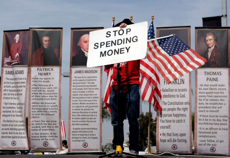 Michael Fell, of Culver City, Calif., holds up a sign reading "STOP SPENDING MONEY" as he speaks at a Tea Party rally. AÃÂ more pragmatic Tea Party movement still represents the best hope for supporters of limited government who want to prevent the Republican Party from lurching back to its Bush-era embrace of big government.ÃÂ (AP Photo/Jae C. Hong)