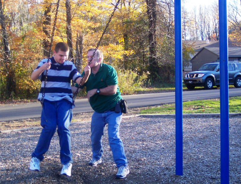 Polk Emerson, a special needs student, plays with his father, Bill. (Courtesy photo)