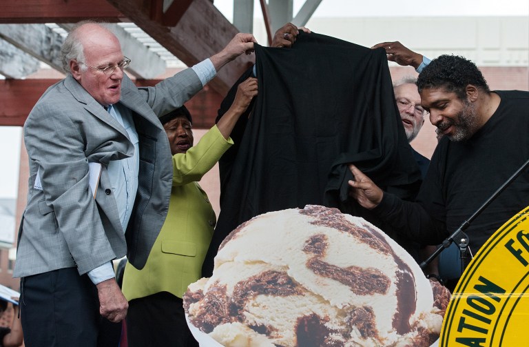 Ben and Jerry's co-founders Ben Cohen, left, and Jerry Greenfield, second from right, unveil a new ice cream flavor called 