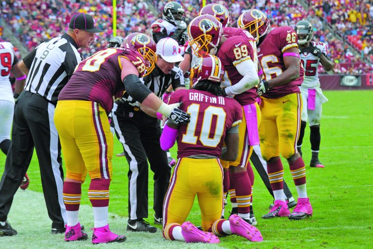 Susan Walsh/AP
Robert Griffin III said he was fine after suffering a concussion against Atlanta on Sunday. His status against the Vikings is uncertain.