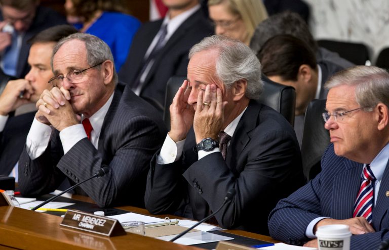 From right to left, Senate Foreign Relations Chairman Robert Menendez, D-N.J., Sen. Bob Corker, R-Tenn., the ranking member, Sen. James Risch, R-Idaho, and Sen. Marco Rubio, R-Fla., listen to testimony from Secretary of State John Kerry, and Defense Secretary Chuck Hagel at a hearing on President Barack Obama's request for congressional authorization for military intervention in Syria, a response to last month's alleged sarin gas attack in the Syrian civil war, on Capitol Hill in Washington, Tuesday, Sept. 3, 2013. (AP Photo/J. Scott Applewhite)