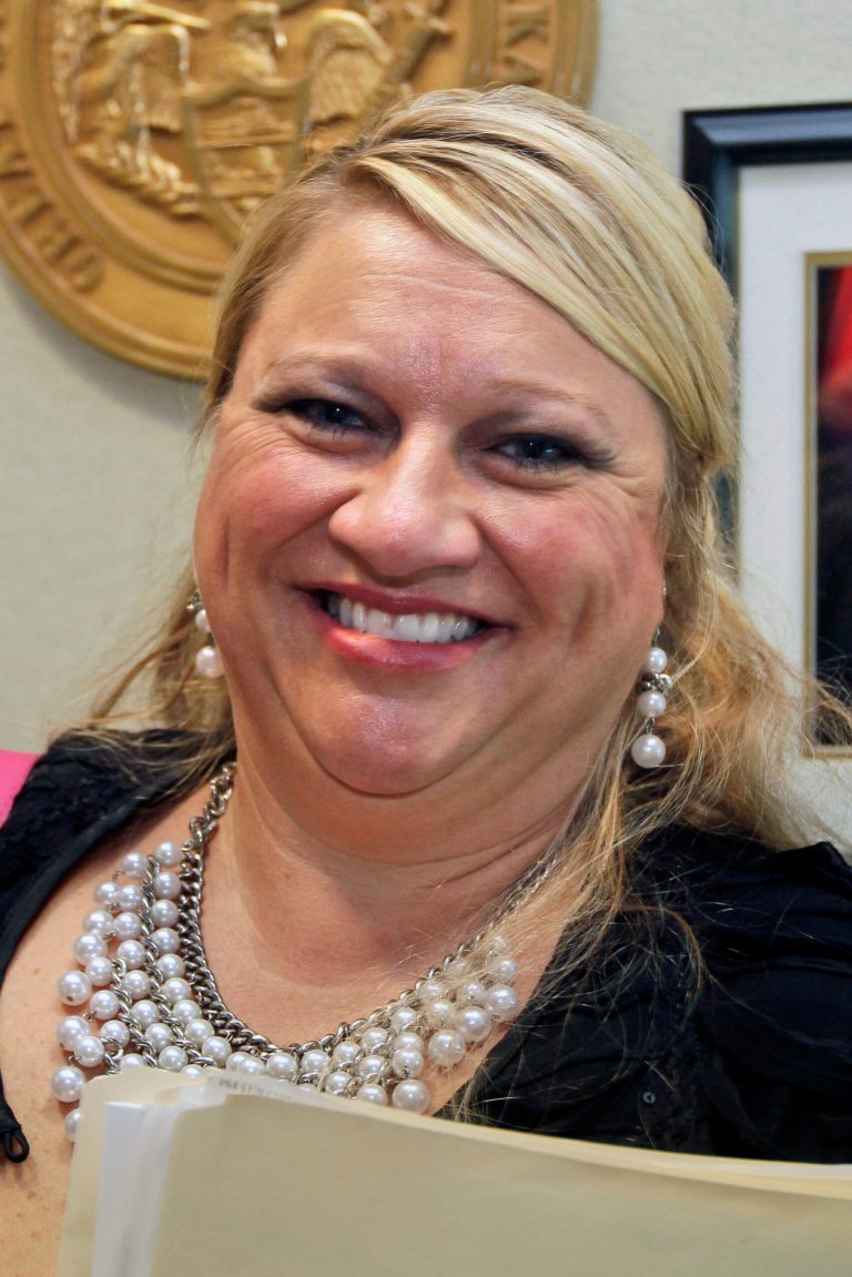 Nancy Anderson, superintendent of the Cutter-Morning star School District, leaves a meeting of Arkansas Board of Private Investigators and Security Agencies in Little Rock, Ark., Wednesday, Sept. 11, 2013. The board is allowing three Arkansas school districts including Anderson's to continue using a licensing law to employ teachers and staff as armed security guards, reversing an earlier decision to block some of the schools from arming employees.(AP Photo/Danny Johnston)