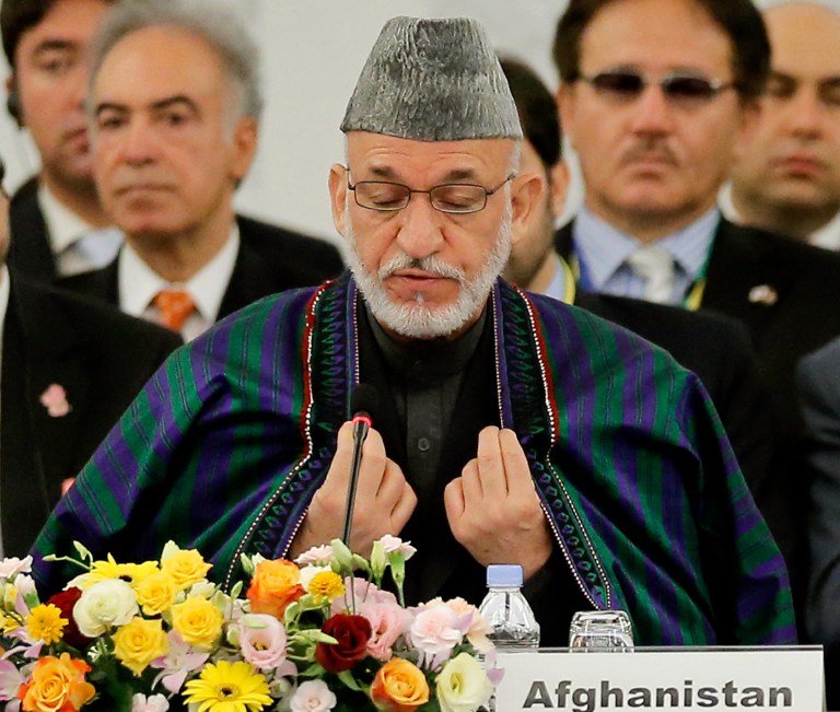 Afghan President Hamid Karzai delivers his speech during the opening session of an international conference on Afghan civilian assistance, at a hotel in Tokyo on Sunday, July 8, 2012. (AP Photo/Itsuo Inouye)