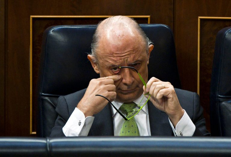   Spain's Finance Minister Cristobal Montoro scratches his face during a control session at the Spanish Parliament, in Madrid, Wednesday, June 13, 2012. The interest rate Spain would have to pay to raise money on the world's bond markets continued to rise Wednesday amid worries that a planned bank bailout might not be enough to save the country from needing an overall financial rescue. (AP Photo/Daniel Ochoa de Olza)  