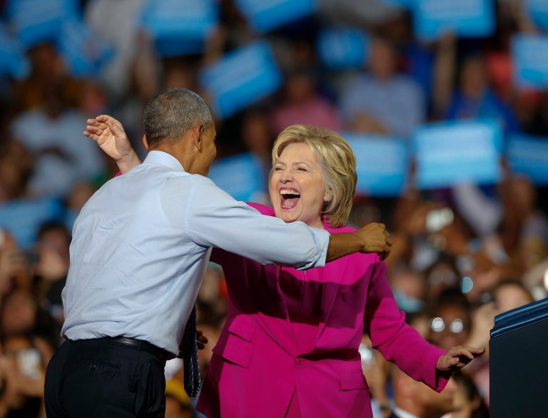 President Barack Obama and Democratic presidential candidate Hillary Clinton embrace during a campaign rally, Tuesday, July 5, 2016, in Charlotte, N.C.. (AP Photo/John Bazemore)