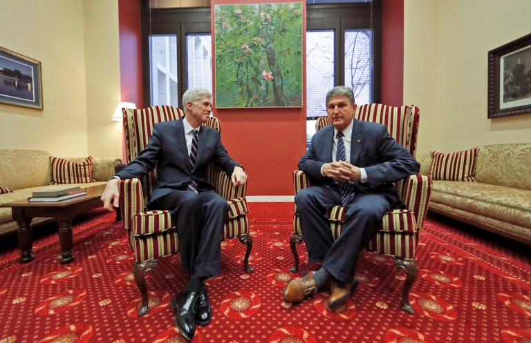 Supreme Court Justice nominee Neil Gorsuch, left, meets with Sen. Joe Manchin, D-W.Va., on Capitol Hill, Wednesday. Manchin believes there are still enough open-minded Democrats in the Senate who can be won over by Gorsuch. (AP Photo/Alex Brandon)