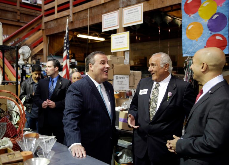 New Jersey Gov. Chris Christie, center, visits with Harold Hoogasian, second from right, president of Hoogasian Flowers, and California gubernatorial candidate Neel Kashkar, right, during a visit to the shop Friday, June 13, 2014, in San Francisco. Christie is in San Francisco as part of a national tour, headlining a high-dollar fundraiser in the liberal stronghold and supporting the California GOP's long-shot nominee for governor. Christie visited the local flower business with Kashkari before going to a luncheon fundraiser. (AP Photo/Eric Risberg)