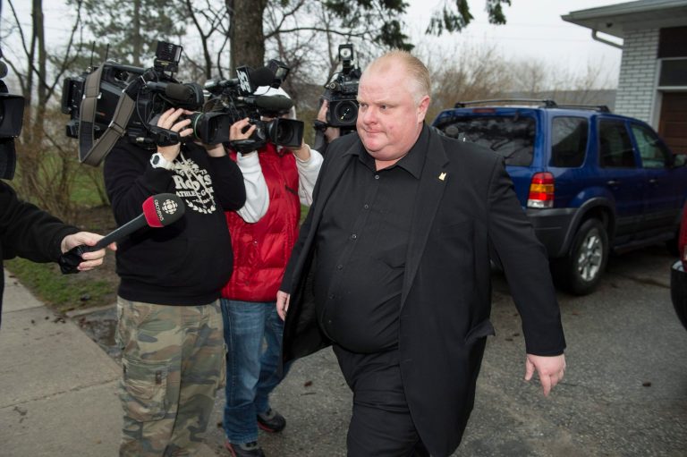 Toronto Mayor Rob Ford leaves his home early Thursday May 1, 2014, in Toronto. Ford will take an immediate leave of absence to seek help for alcohol, he said, as a report surfaced about a second video of the mayor smoking what appears to be crack cocaine. (AP Photo/The Canadian Press, Frank Gunn)