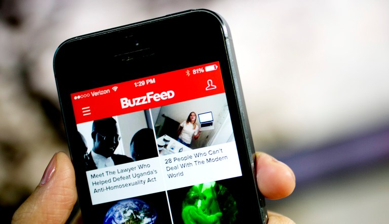 The Buzzfeed Inc. application (app) is displayed on an Apple Inc. iPhone 5s in this arranged photograph in Washington, D.C. 