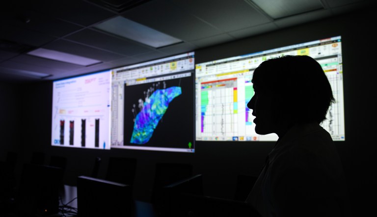 Vice President of Engineering and Development of CNX Resources Corporation Andrea Passman stands in a control room that is used for predicting drilling locations at CNX's headquarters on July 30 in Cannonsburg, Pa.   