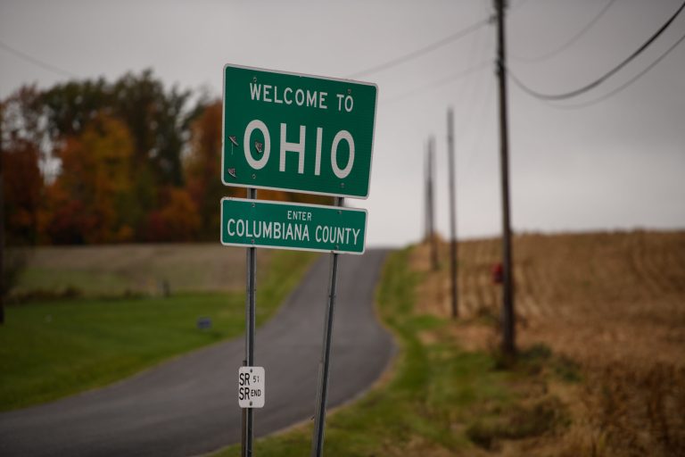 A welcome to Ohio sign sits along Constitution Boulevard on the state line.