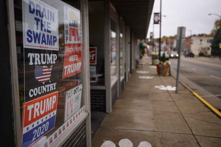 Signs supporting Donald Trump hang in the window of the East Palestine Republican Headquarters along North Market Street in East Palestine, Ohio.