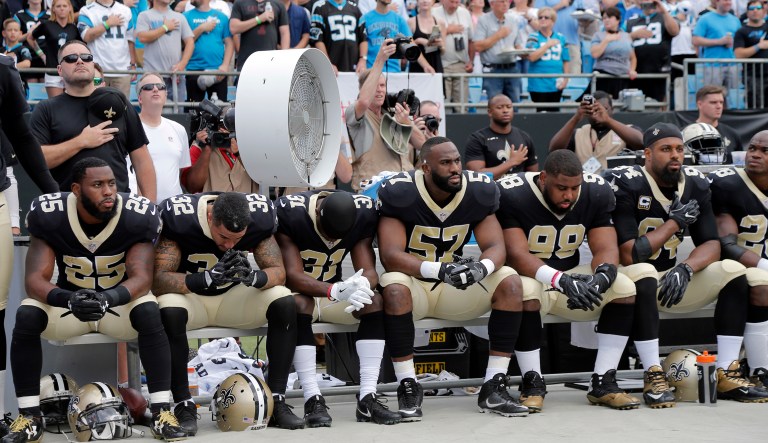 Ten Saints players sat during the national anthem, including running back Adrian Peterson. (AP Photo/Bob Leverone)