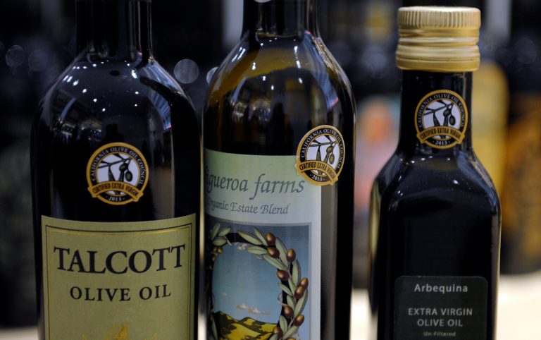 The tiny California olive industry says European olive oil filling U.S. shelves often is mislabeled and lower-grade oil, and they're pushing the federal government to give more scrutiny to imported varieties. (AP Photo/Susan Walsh)