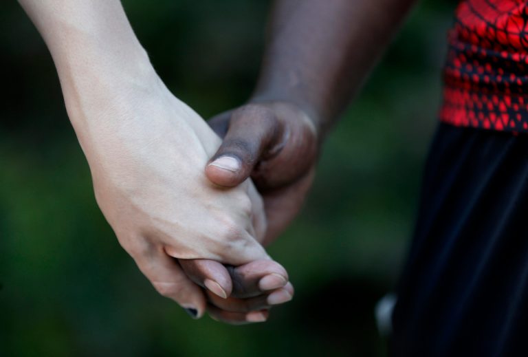 On Tuesday night, Obama's message was one of racial inclusiveness. (AP Photo/Gerald Herbert)
