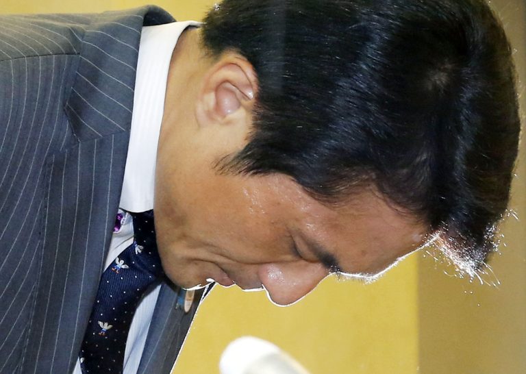 In this Monday, June 23, 2014 photo, Tokyo assemblyman Akihiro Suzuki bows to apologize for his remarks to his female colleague Ayaka Shiomura during a press conference at Tokyo Metropolitan City Hall in Tokyo. The uproar over the rude comments aimed at Ayaka Shiomura by several male lawmakers, including Suzuki, reflects both greater awareness of women's issues and the pervasiveness of traditional chauvinist attitudes in business and political circles. The latter poses a major challenge to Prime Minister Shinzo Abe's goal of greater advancement for Japan's well-educated but underemployed women, a mainstay in his arsenal of strategies for reviving the economy. (AP Photo/Kyodo News) JAPAN OUT, MANDATORY CREDIT