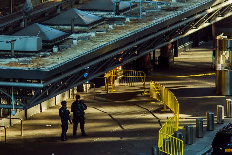 Police stand guard in front of Port Authority Bus Terminal following an explosion near New York's Times Square on Monday, Dec. 11, 2017. Police said a man with a pipe bomb strapped to him set off the crude device in an underground passageway under 42nd Street between Seventh and Eighth Avenues. (AP Photo/Andres Kudacki)