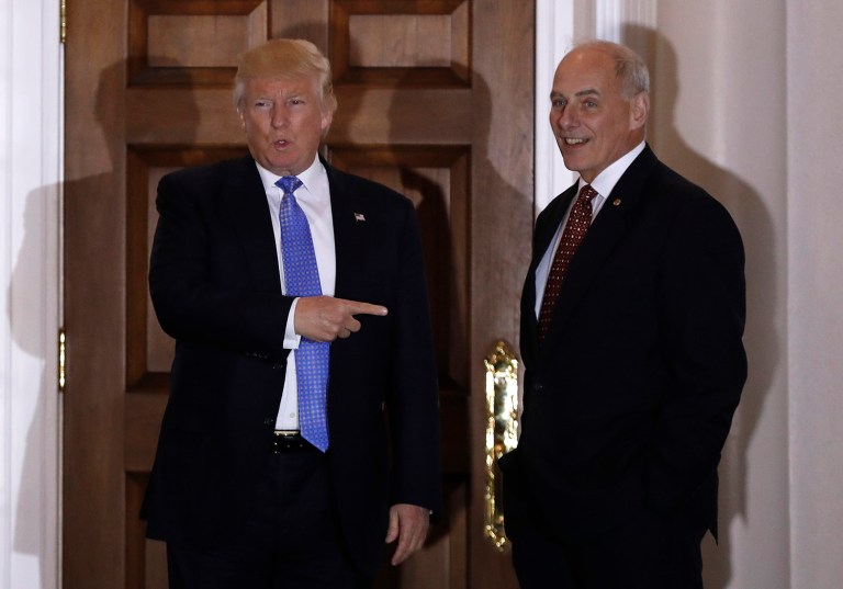 President-elect Donald Trump talks to media as he stands with retired Marine Gen. John Kelly, right, at the Trump National Golf Club Bedminster clubhouse Sunday, Nov. 20, 2016, in Bedminster, N.J.. (AP Photo/Carolyn Kaster)