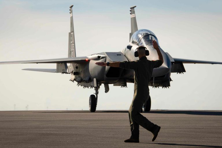 Master Sgt. Tristan McIntire, 40th Flight Test Squadron, marshals the F-15EX to a stop at Eglin Air Force Base, Florida.