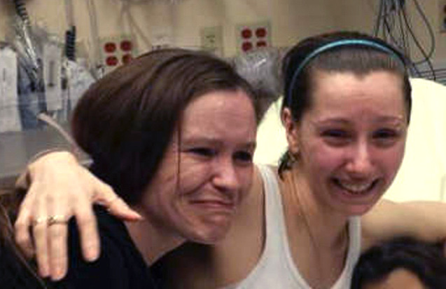 Amanda Berry, right, hugs her sister Beth Serrano after being reunited. Berry and two other women were found in a house near downtown Cleveland Monday after being kidnapped as teenagers. That matches the profile of local teens who have been lured into prostitution by criminals who use them to generate up to $1,000 a day in profits. (AP Photo/Family Handout courtesy WOIO-TV)