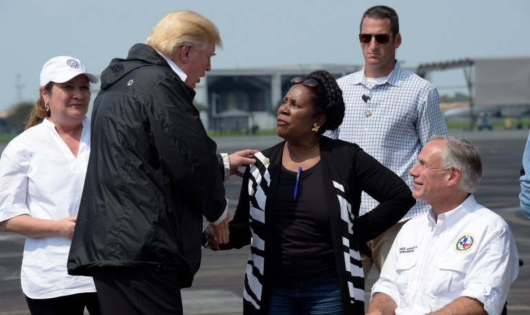 President Donald Trump talks with Rep. Sheila Jackson Lee, D-Texas, and Texas Gov. Greg Abbott before boarding Air Force One at Ellington Field after meeting people impacted by Hurricane Harvey during a visit to Houston. (AP Photo/Susan Walsh)