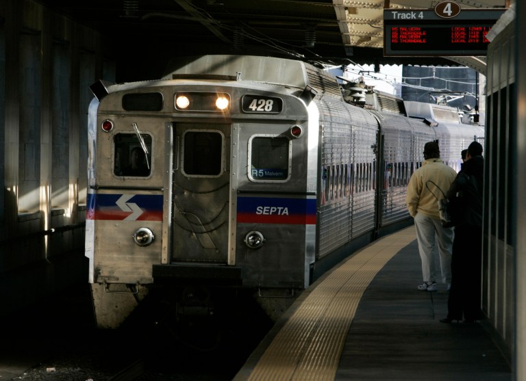 FILE - A SEPTA regional train, the R7, rolls into 30th Street station in Philadelphia in this Nov. 16, 2004 file photo. Four hundred workers at a Philadelphia-area regional rail system went on strike Saturday morning June 14, 2014, shutting down 13 train lines that carry commuters to the suburbs and Philadelphia International Airport. Subways, trolleys and buses operated by SEPTA will continue to run.  (AP Photo/Jacqueline Larma, File)