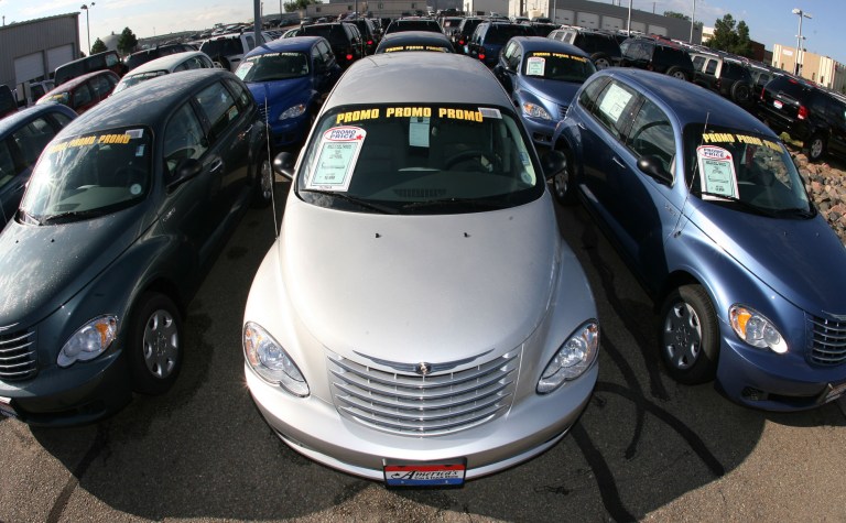   FILE- In this Sunday, Aug. 27, 2006, file photo, rows of unsold Chrysler PT Cruisers and Jeep Liberty sports utility vehicles sit on the lot of a Chrysler-Jeep dealership in the south Denver suburb of Centennial, Colo. Chrysler announced Monday, June 11, 2012, that it is adding more than 137,000 Jeep Liberty SUVs to a safety recall announced in March, extending the recall to 2006 and 2007 model years from the previous recall of model years 2004 and 2005. The recall now totals nearly 347,000 vehicles. (AP Photo/David Zalubowski, File)  