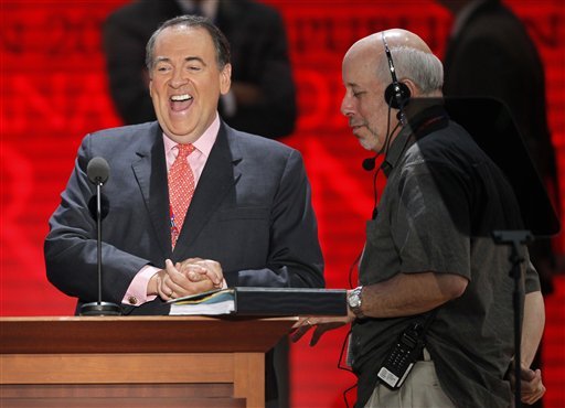 Former governor of Arkansas and conservative talk show host Mike Huckabee checks out the stage at the Republican National Convention inside the Tampa Bay Times Forum, Sunday, Aug. 26, 2012, in Tampa, Fla.  (AP Photo/Charles Dharapak)
