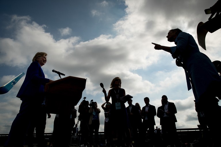 Democratic presidential candidate Hillary Clinton took six questions from reporters before boarding her plane at Westchester County Airport in White Plains, N.Y. (AP Photo/Andrew Harnik)