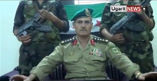 Defections signal Syrian regime losing its grip, analysts say