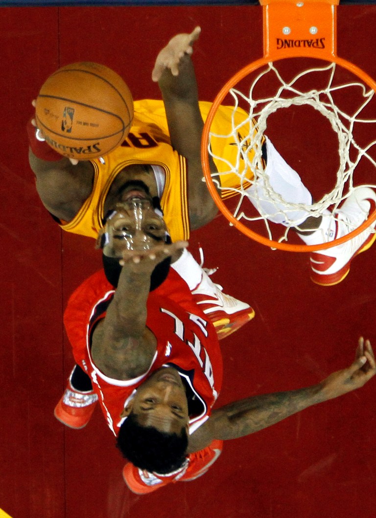   Cleveland Cavaliers' Tristan Thompson, top, shoots against Atlanta Hawks' Josh Smith in the first quarter of an NBA basketball game, Friday, Dec. 28, 2012, in Cleveland. (AP Photo/Mark Duncan)  